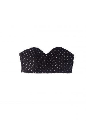 A black strapless top with a small pattern on it.