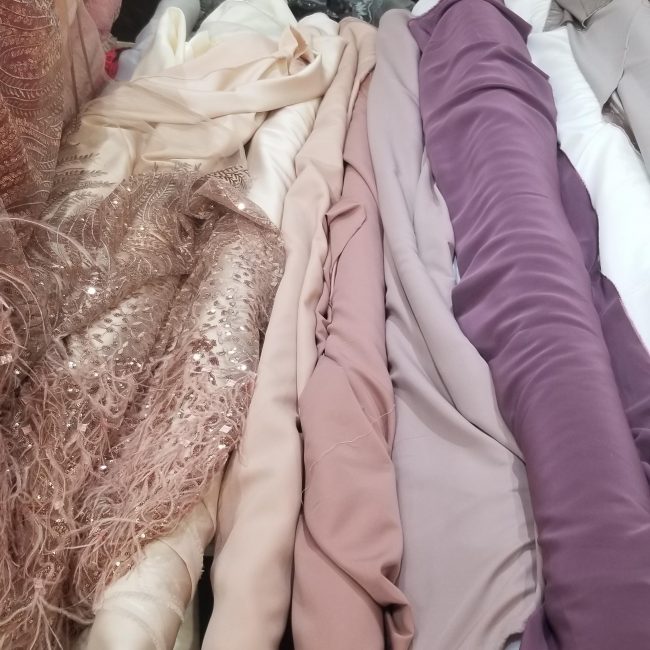 A pile of different colored fabrics and materials.